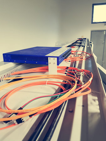 Fiber optic cables running from a switch.