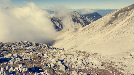 Aerial view of mountain ridge surrounded with clouds.の写真素材