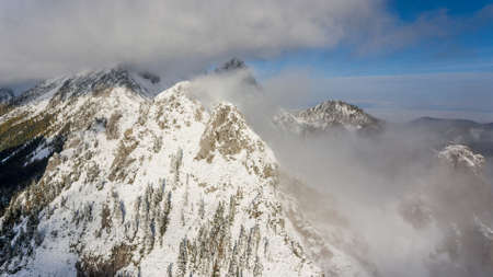 First snow covering mountain top.の写真素材
