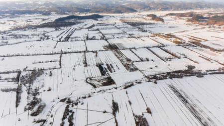Aerial view of snow covered countryside.の写真素材