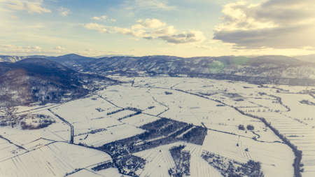 Aerial view of snow covered countryside.の写真素材
