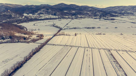 Aerial view of snow covered countryside.の写真素材