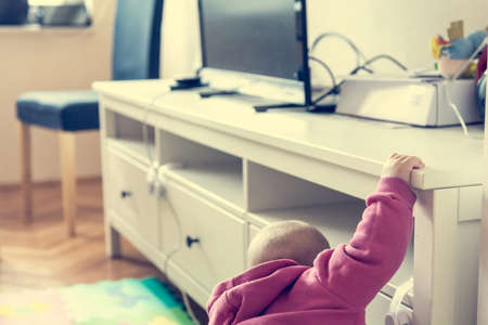 Baby exploring living room.の写真素材