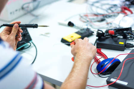 Electrician soldering wires.の写真素材