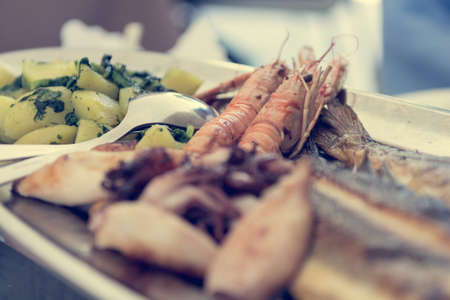Plate of delicious grilled sea food.の写真素材