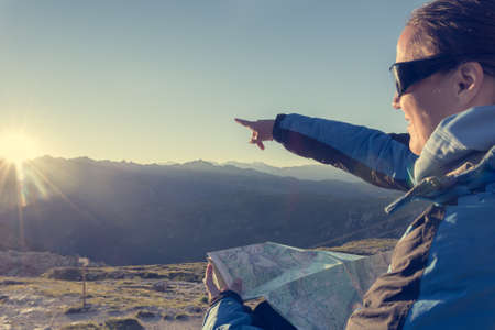 Female traveler showing the way.の写真素材