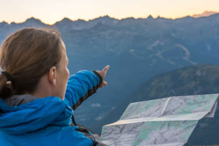 Female hiker showing the way.の写真素材