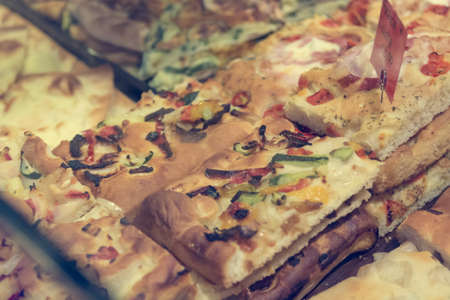 Local bakery selling delicious pizzas and focaccia bread.の写真素材