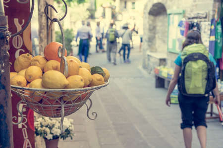 Pile of fresh lemons hanging at a fruit store.の写真素材