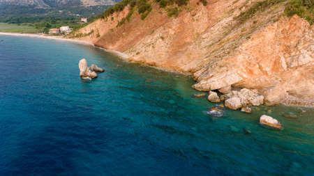 Aeriel view point of sheer cliffs raising from the sea.の写真素材