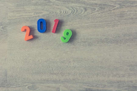 Happy New Year 2019 written with colorful plastic numbers.の写真素材