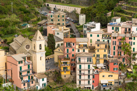 Traditional port town with colorful mediterranean architecture. Riomaggiore, Italy.