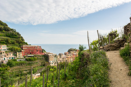 Traditional port town with colorful mediterranean architecture. Riomaggiore, Italy.