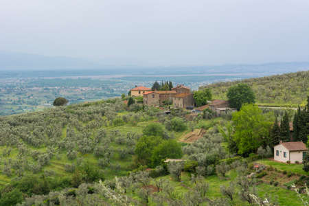 Spectacular countryside with houses build on top of hill.の写真素材