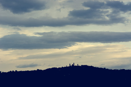 Medieval town cityscape seen from a far at evening.の写真素材