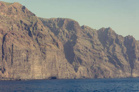 Sheer cliffs of Los Gigantes raising above Atlantic ocean.の写真素材