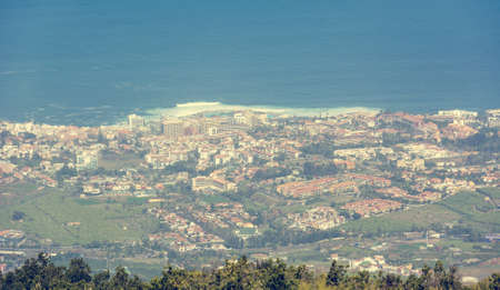 Landscape view of coastal city from far away.の写真素材