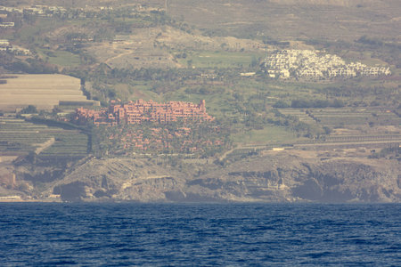 Coastal luxury resorts and coastline viewed from boat trip.の写真素材