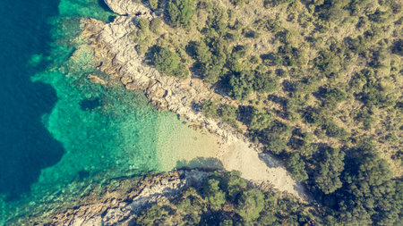 Spectacular aerial sea landscape of rocky coast and crystal clear water.