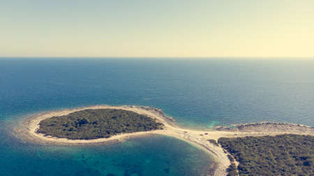 Spectacular aerial sea landscape of rocky coast and crystal clear water.の写真素材