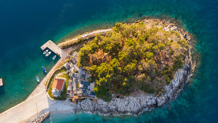 Drop down view of coastal village at sunset.