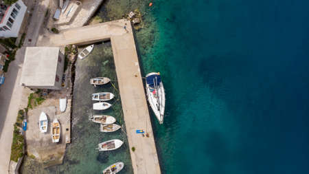 Drop down view of fishing port with boats tied in.の写真素材