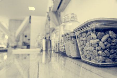 Closeup of cacoa beans in a glass bowl in zero waste store.