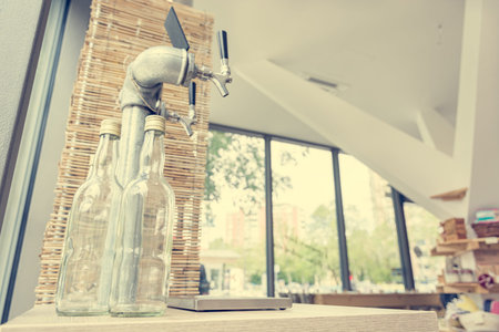 Closeup of metallic tap for pouring organic juices in bulk shopping store.の写真素材