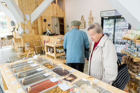 Elderly couple in a zero waste store bulk shopping.の写真素材