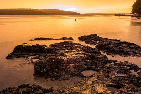 Spectacular sea sunset after thunder storm with long exposure technique.