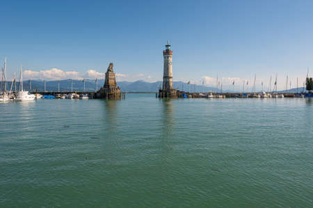 Picturesque lake port with famous bavarian lion entrance.の写真素材