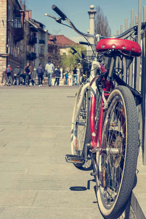 Low angle view of red bycicle parked on a square.の写真素材