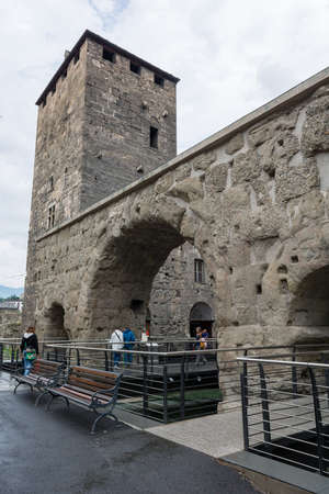 Aosta, Italy - July 20, 2014: Tourists exploring old Roman ruins in Aostaのeditorial素材