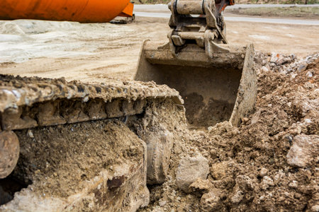 Tracks of a excavator machine on a construction site.