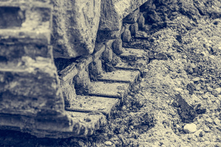 Tracks of a excavator machine on a construction site.