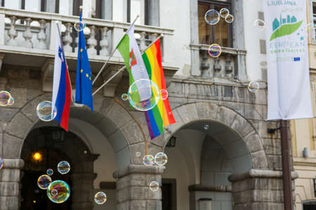 Ljubljana, Slovenia - June 17, 2016: Many bubbles floating infront of city hall in sign of support of equal rights movementのeditorial素材