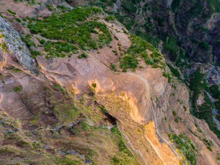 Drop down view of trail following volcanic mountain ridge.の写真素材