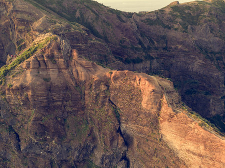 Aerial view of picturesque volcanic mountains at sunrise.