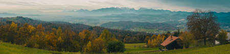 Autumn panorama of Kamnisko Savinjske alps in Slovenia, viewed from hills above Moravce region and looking north towards majestic mountains.の写真素材