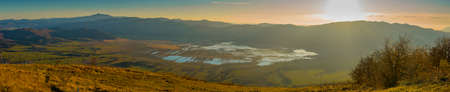 Majestic panoramic view from the top of the Slivnica mountain over the Cerknica lake in Slovenia on a warm autumn day.の写真素材