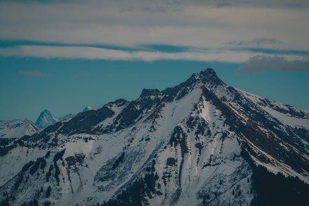 Beautiful mountain panorama from Leysin range on a cloudy winter day. Looking towards mountains at Les Diablerets.の写真素材