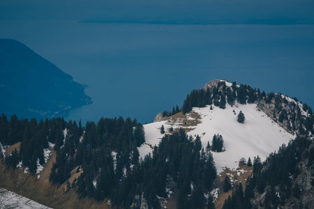 Beautiful mountain panorama from Leysin range on a cloudy winter day. Looking towards Lac Leman and...