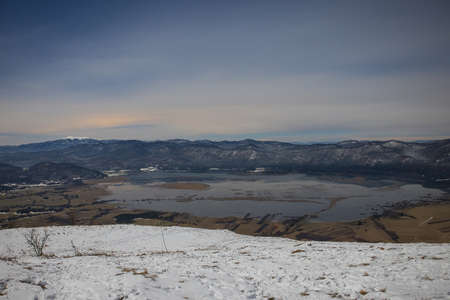 Night panorama of Cerknica lake viewed from above from Slivnica vantage point during late night. Long exposure photo of Cerknica lake.の写真素材