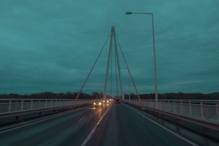 Cloudy and rainy atmosphere on a concrete suspension bridge.の写真素材