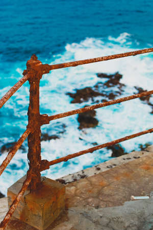 Rusty metal fence on the top of lighthouse of Maria Pia in the city of Praia, Cape Verde.の写真素材