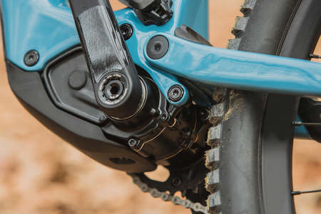 Details of electric mountain bicycle in blue color. Visible  electric motor hidden in bottom bracket.の写真素材
