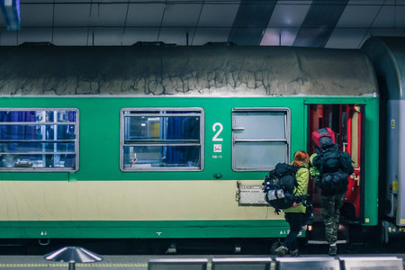 Exterior of Polish green sleeping train wagon, standing on a platform on a train station in Krakow...