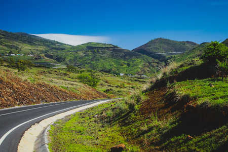 Curvy road to Pico do Fogo, volcano on the island of Fogo on Cabo Verde islands, Lush hills covered in grassの写真素材