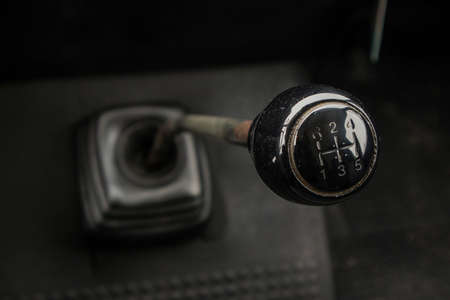 A gear stick of an old van. Visible knob, stick and rubber boot on the floor.の写真素材