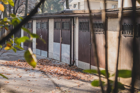 Row of old and socialistic garages or parking boxes made in the sixties in eastern europe. Looking...